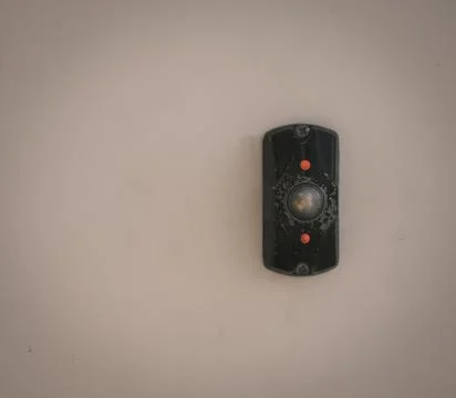 An electronic metall button om the light background Stock Photos