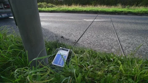 Electronic meter recording passing traffic on single carriageway UK Stock Footage 142509527
