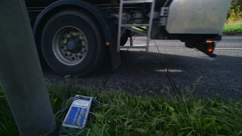 Electronic meter recording passing traffic on single carriageway UK Stock Footage 142509636