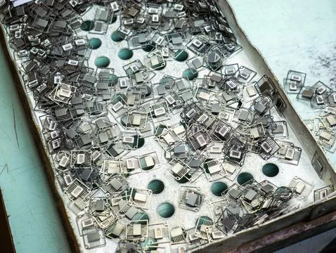 Electronic Microchip Components and Lead Frames in Metal Tray Stock Photos