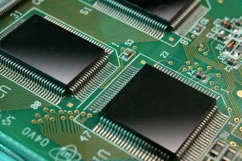 Electronic microchips on circuit board close-up Stock Photos
