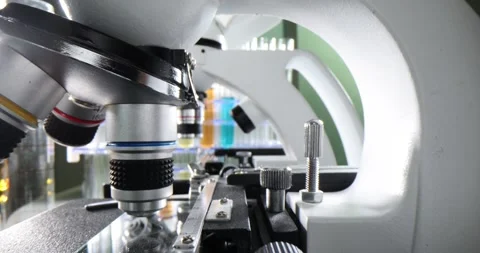 Electronic microscopes on table in laboratory next to chemicals Stock Footage 264382931