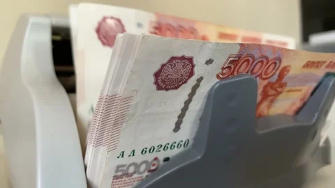 Electronic money counter machine is counting the Russian five-thousandth ruble Stock-Footage 168986884