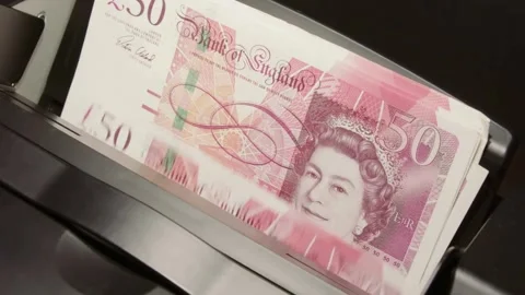 Electronic money counting machine processing fifty pound notes Stock-Footage 333739778