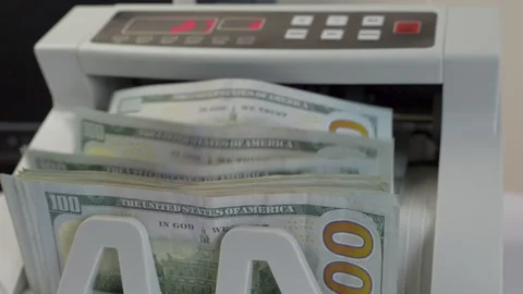Electronic Money Counting Machine Processing a Stack of US 100 Dollar Bills Stock Footage 337280419