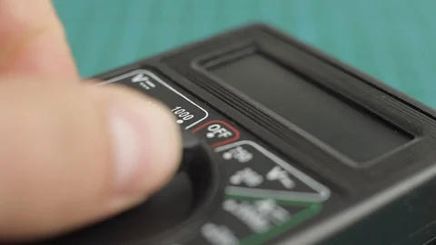 Electronic multimeter tool power on. And measuring voltage test. Close up Video stock 128820235