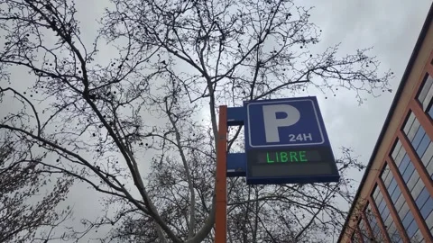 Electronic parking sign showing available spaces with flashing arrows Stock Footage 340326713