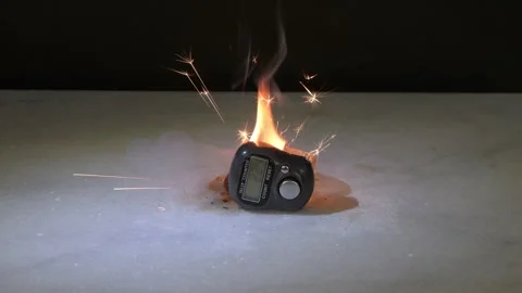 The electronic pedometer sparks and lights up due to a fault, creating a hazardo Stock Footage 332169918