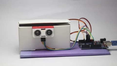 Electronic project that uses ultrasonic sensor controlling micro servo Stock Footage 321893179