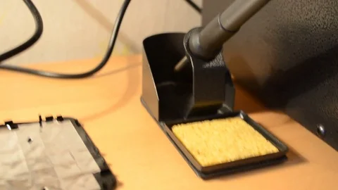 Electronic repairing process using solder and multimeter. V1 Stock Footage 92071798