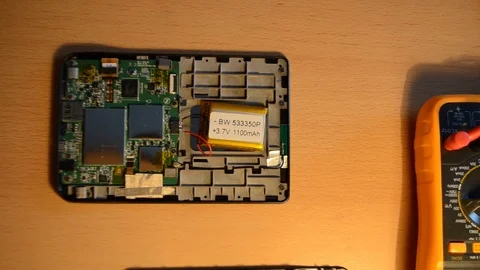 Electronic repairing process using solder and multimeter. V8 Stock Footage 92071963