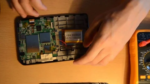 Electronic repairing process using solder and multimeter. V9 Stock Footage 92071981