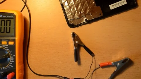 Electronic repairing process using solder and multimeter. V12 Stock Footage 92072030