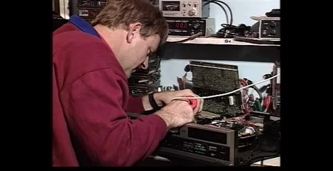 Electronic Repairman Using Tools – 1990s Stock Footage 318947204