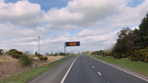 An electronic road sign with information about the coronavirus, slow motion, 4K Video stock 129118475