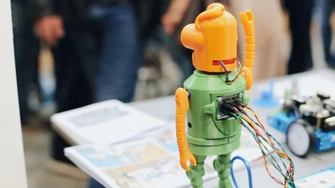 An electronic robot waving hands in a shopping center Stock Footage 80982457