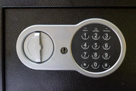 Electronic safe lock with keypad handle and indicator lights in close view Stock Photos