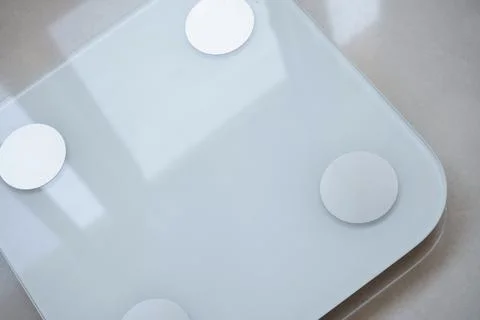 Electronic Scale on marble floor Stock Photos