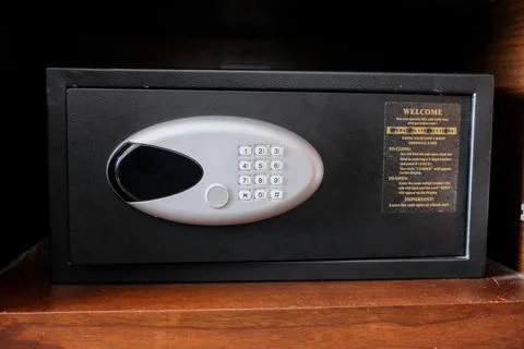 Electronic security safe box with digital keypad and instruction in a hotel room Stock Photos