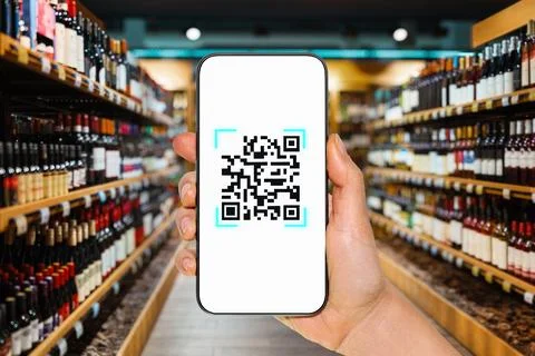 Electronic shelf label and e-label of wine product scanning by phone Stock Photos