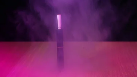 Electronic smoke device table dark background nobody hd footage Stock Footage 100451868