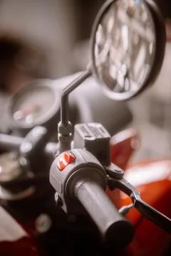 Electronic start button on a motorcycle Stock Photos