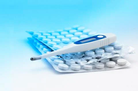 Electronic thermometer and tablets Stock Photos