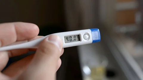 Electronic thermometer shows high temperature 40 Stock Footage 121321130