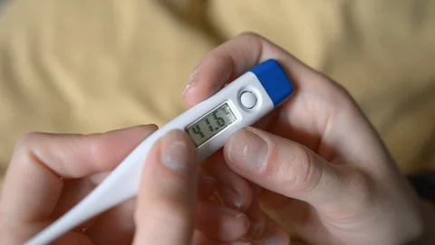 Electronic thermometer shows high temperature 41.6 Video stock 121321299