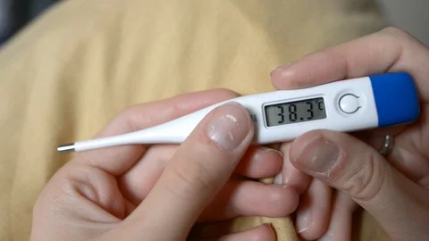 Electronic thermometer shows high temperature Stock Footage 121321603