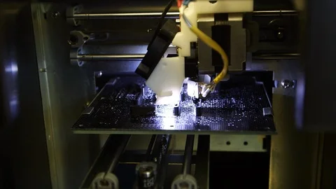 Electronic three dimensional plastic printer during work in studio Stock Footage 99054981