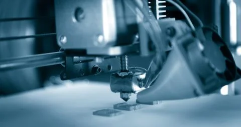 Electronic three dimensional plastic printer during work , 3D printer. Stock Photos