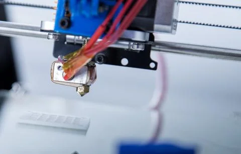 Electronic three dimensional plastic printer during work , 3D printer. Stock Photos