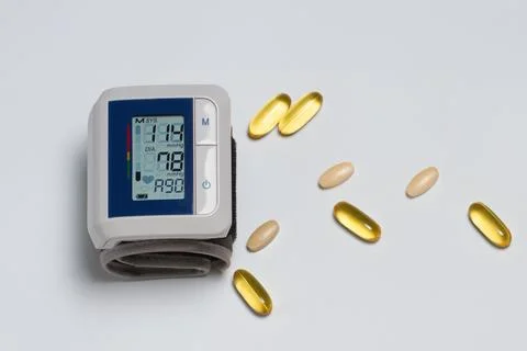 Electronic tonometer on the background of tablets Stock Photos