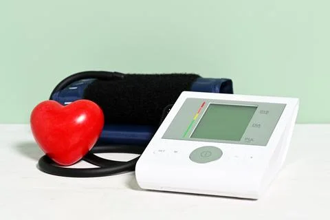 Electronic tonometer device with red heart Stock Photos