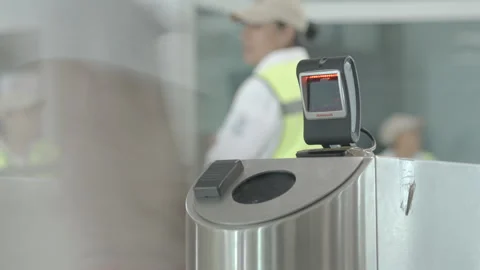 Electronic turnstile scanning barcodes for automated worker access control Stock Footage 345102599