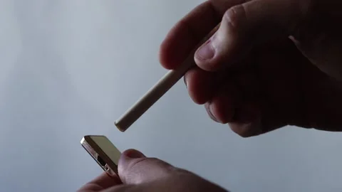 Electronic usb lighter and cigarette in male hand Stock Footage 164529019
