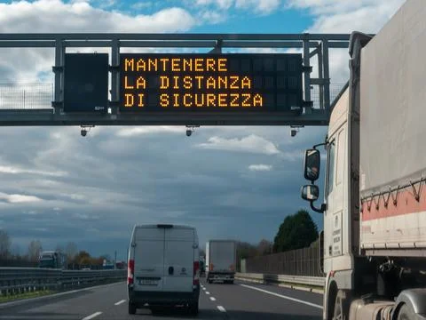 Electronic variable message sign showing safety distance warning on Autostr.. 스톡 사진