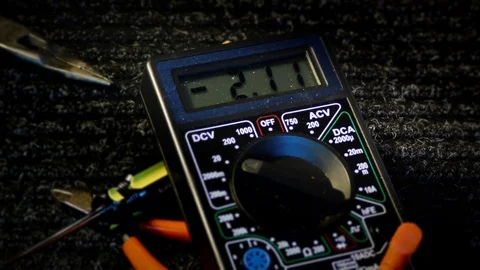 Electronic Volt Meter Measures 4 volts Stock Footage 101033865