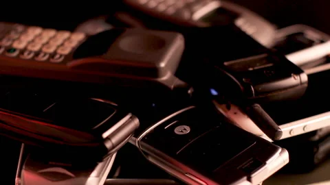 Electronic Waste, Bunch of Different Old Used Cellphones on a Spinning 스톡 동영상 136753207