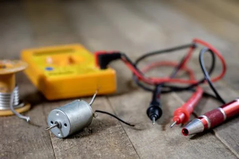 Electronic workshop. Electric meter and soldering iron. Stock Photos