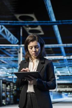 Electronics checkup, tablet and employee in data center Stock Photos