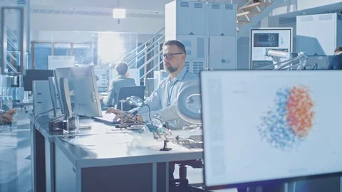 Electronics Design Engineer Takes His Place Starts Working with Circuit Boards Stock Footage 105370626