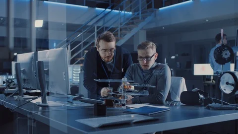 Electronics Development Engineer Talks with Project Manager, they Choose PCB Stock Footage 104594430