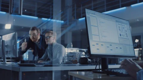 Electronics Development Engineer Uses Personal Computer Talks with Manager Stock Footage 104595409