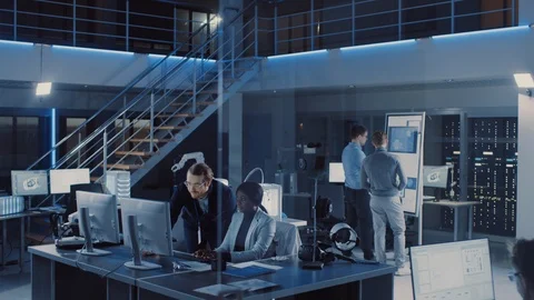 Electronics Development Engineer Working on Computer, Talks with Project Manager Stock Footage 104556919