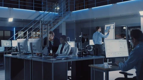 Electronics Development Engineer Working on Computer, Talks with Project Manager Stock Footage 104557152