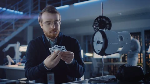 Electronics Development Engineer Working at His Desk, Fits New Technology Stock Footage 104553159