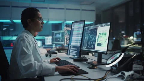 Electronics Development Facility Female Scientist Working on Computer Video stock 147044438