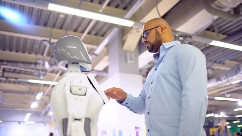 Electronics engineer and robot. High technologies and robots Stock Footage 86450769